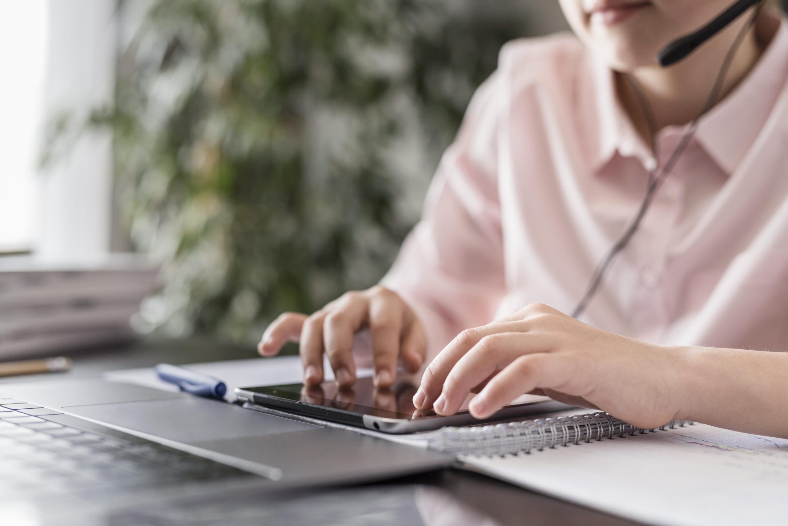 Woman typing on Ipad